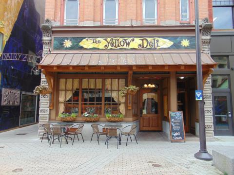 Deli entrance with outdoor seating (weather permitting).